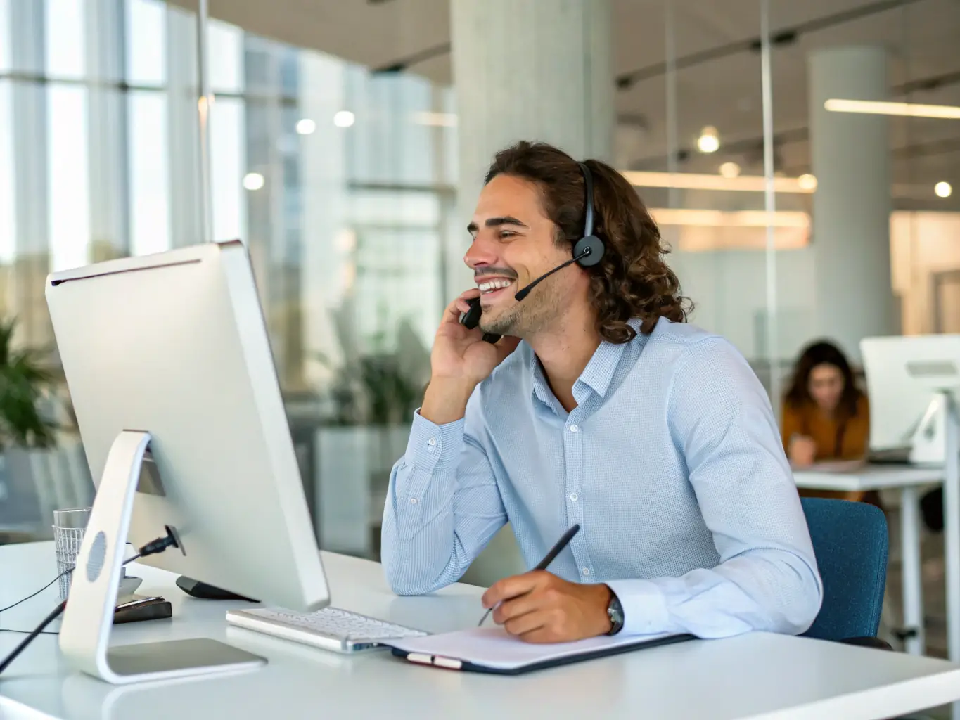 A customer placing a phone call to Stretch Ceilings to inquire about their services, with a friendly representative answering the call.